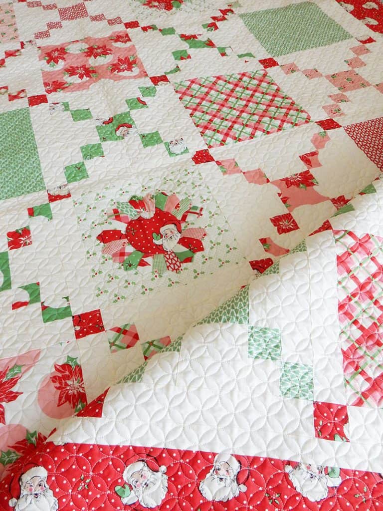 Best Tips for Storing Christmas Quilts and Decor featured by Top US Quilting Blog, A Quilting Life: image of Pot Luck Quilt in Swell Christmas