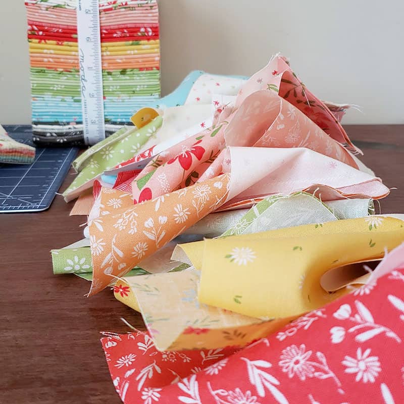 Scraps-Along: 12 Months of Scrappy Challenges featured by Top US Quilting Blog, A Quilting Life: image of Summer Sweet fabric scraps