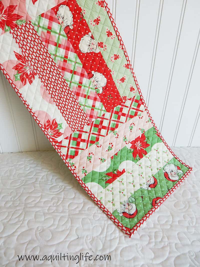 Saturday Seven 107 featured by top US Quilting Blog, A Quilting Life: image of Christmas Table Runner