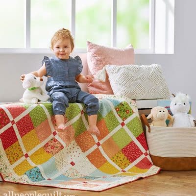 Charm Square Baby Quilt in Quilts & More featured by Top US Quilting Blog, A Quilting Life: image of charm square baby quilt
