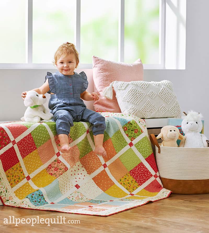 Charm Square Baby Quilt in Quilts & More featured by Top US Quilt Blog, A Quilting Life: image of New Kid on the Block baby quilt