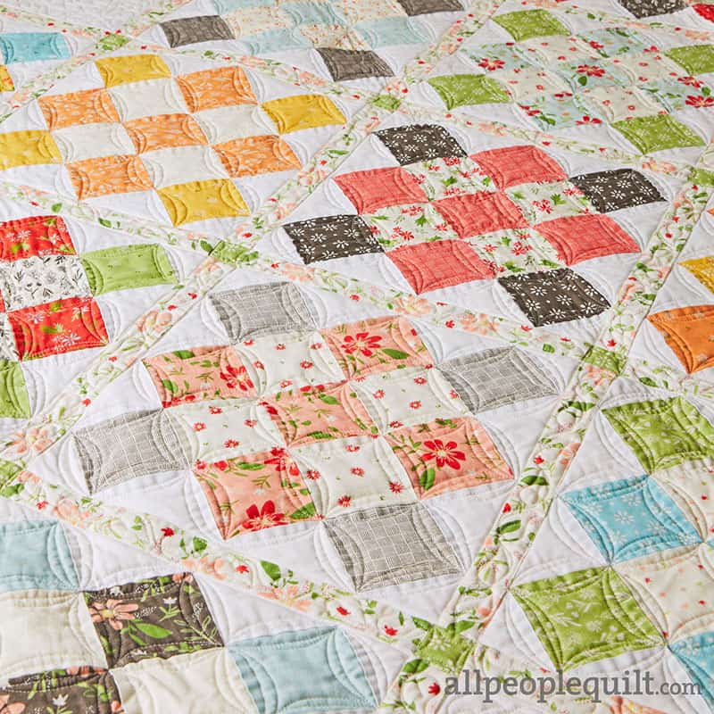 Granny Squared Quilt in Summer Sweet featured by Top US Quilting Blog, A Quilting Life: image of close up of custom quilting detail.