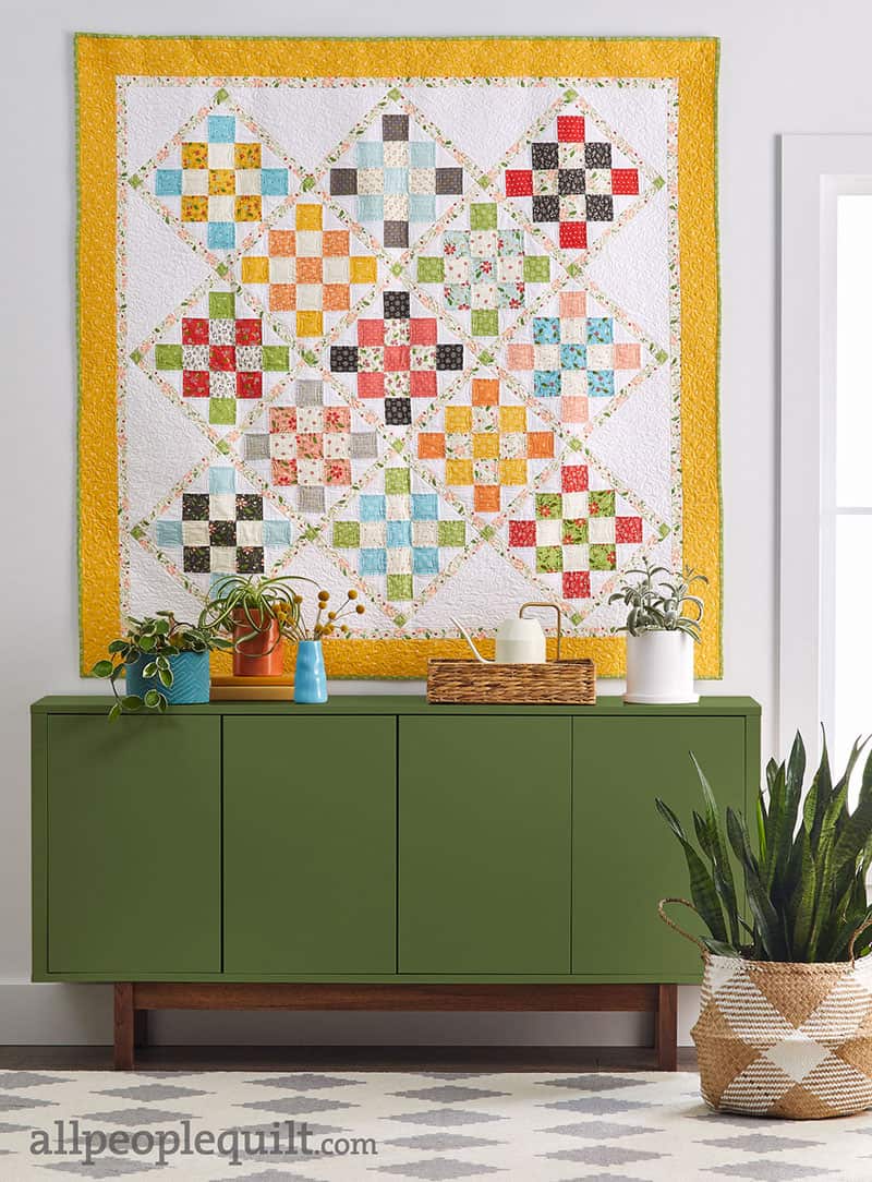 Granny Squared Quilt in Summer Sweet featured by Top US Quilting Blog, A Quilting Life: image of Granny Squared Quilt