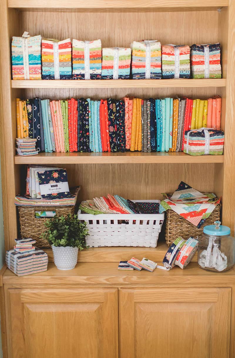 A Quilting Life at Home | Sewing Room featured by Top US Quilting Blog, A Quilting Life: image of fabric on shelves