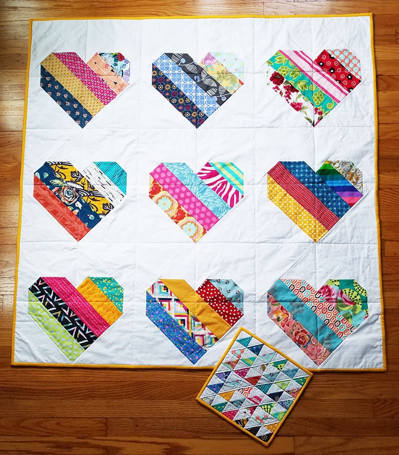 Scraps Along February featured by Top US Quilting Blog, A Quilting Life: image of Jelly Roll Hearts Quilt