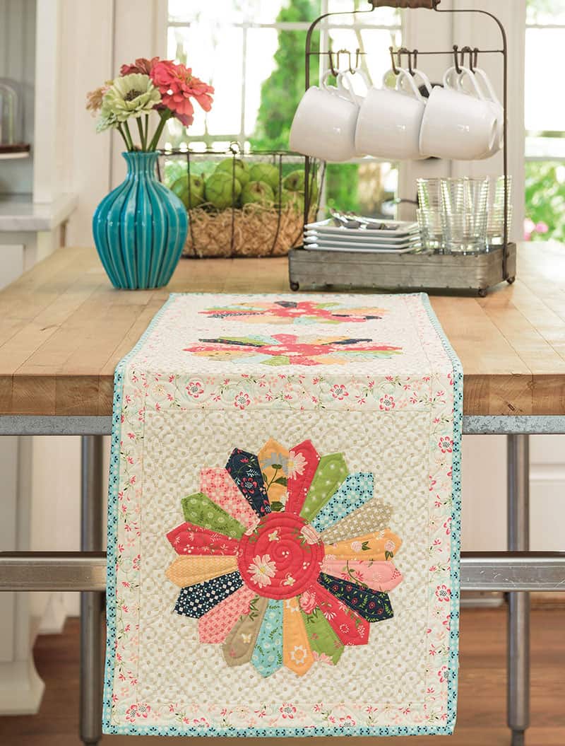 Labor of Love Quilts Part 1 featured by Top US Quilting Blog, A Quilting Life: image of Scrappy Dresdens table runner