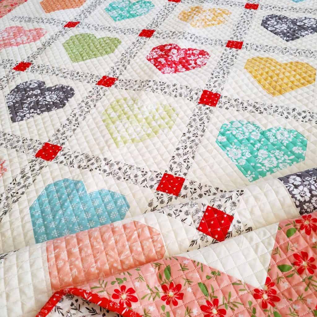 Lovely Heart Quilt Pattern featured by Top US Quilting Blog, A Quilting Life: image of Lovely Heart Quilt