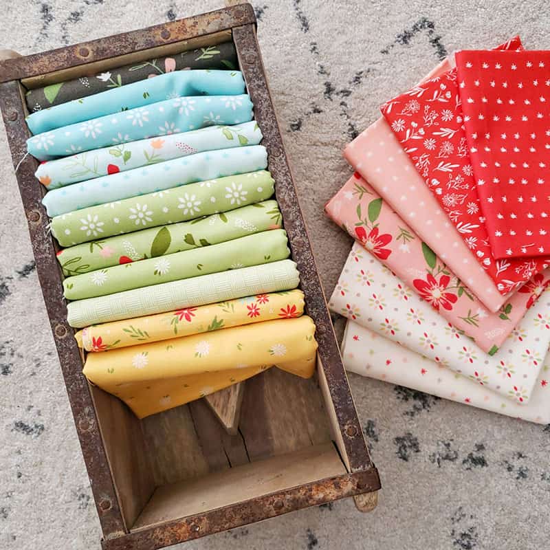 Saturday Seven 119 featured by Top US Quilting Blog, A Quilting Life: image of Summer Sweet fabrics in a box