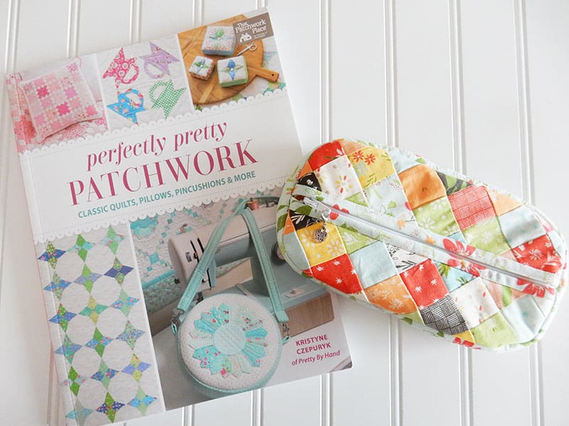 Patchwork Pouch in Summer Sweet Fabrics featured by Top US Quilting Blog, A Quilting Life: image of book and pouch.