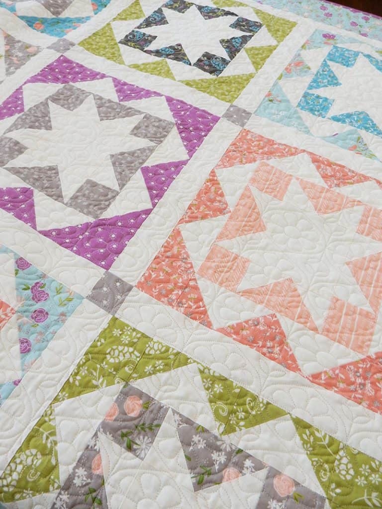 Sawtooth Star Quilt Block Featured by Top US Quilting Blog, A Quilting Life: image of Carefree fat quarter quilt