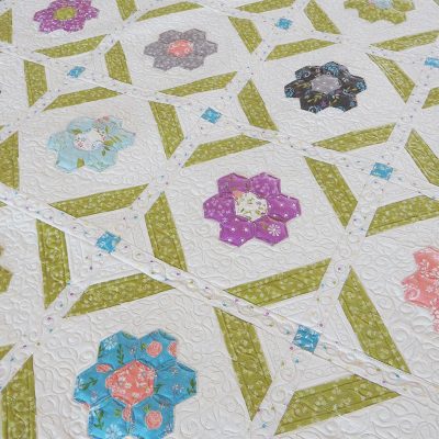 Blooms Grandmother's Flower Garden Quilt Pattern featured by Top US Quilting Blog, A quilting Life: image of Blooms quilt