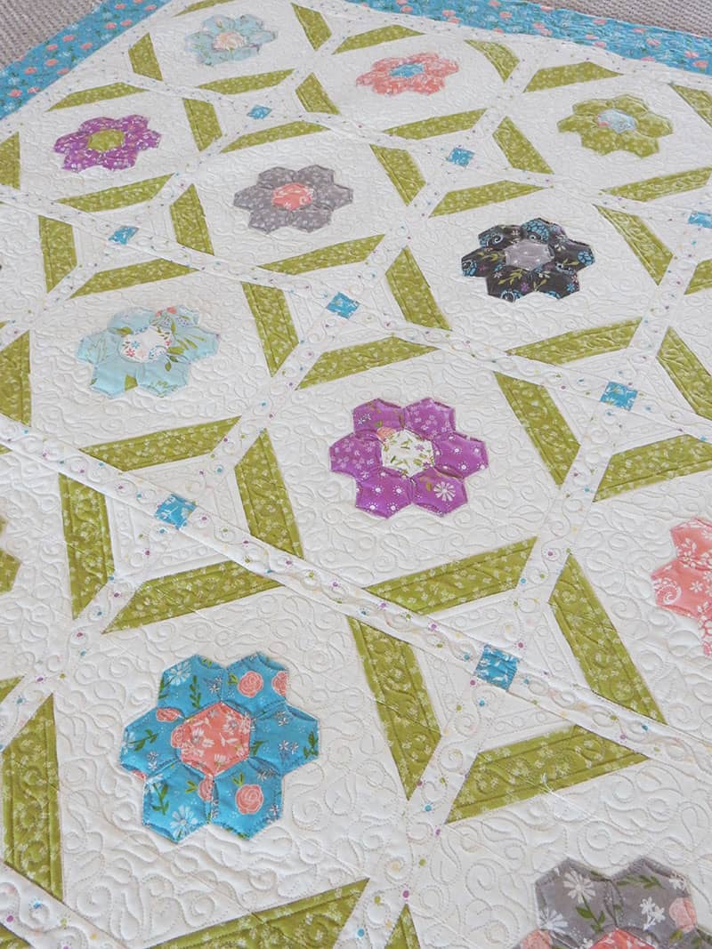 Blooms Grandmother's Flower Garden Quilt Pattern featured by Top US Quilting Blog, A quilting Life: image of Blooms quilt