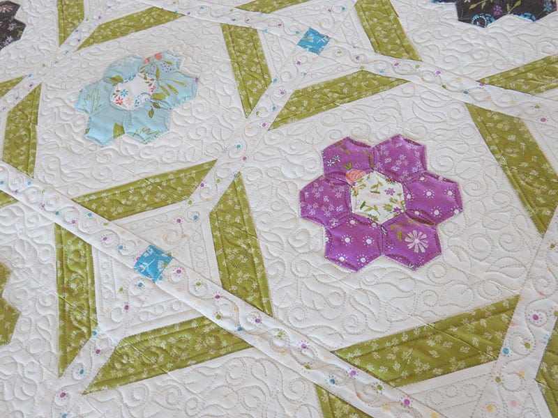 Blooms Grandmother's Flower Garden Quilt Pattern featured by Top US Quilting Blog, A quilting life: image of blooms quilt