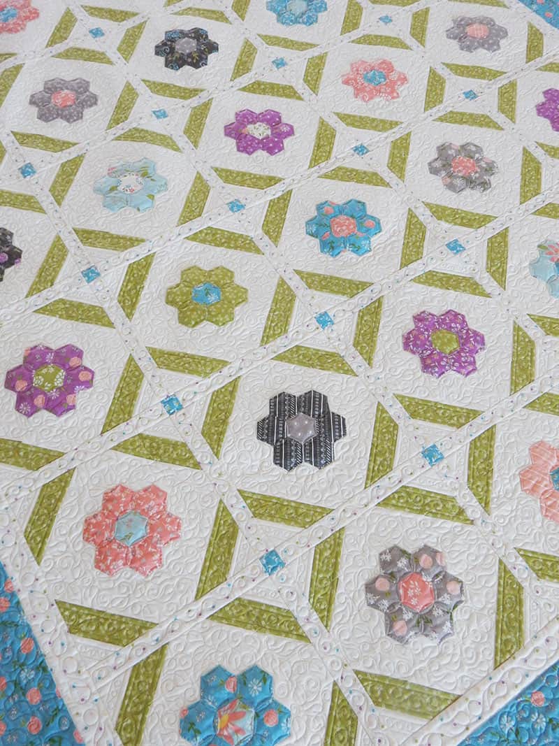 Blooms Grandmother's Flower Garden Pattern featured by Top US Quilting Blog, A Quilting Life: image of Blooms Quilt pattern