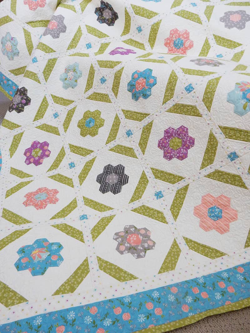 Blooms Grandmother's Flower Garden Quilt featured by Top US Quilt Blog, A Quilting Life: image of Blooms quilt