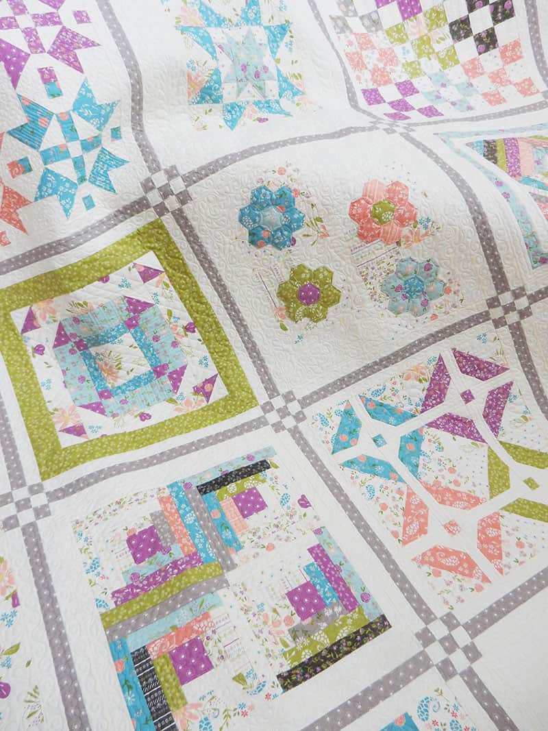 Labor of Love Sampler Quilt featured by Top US Quilting Blog, A Quilting Life: image of Sampler Quilt