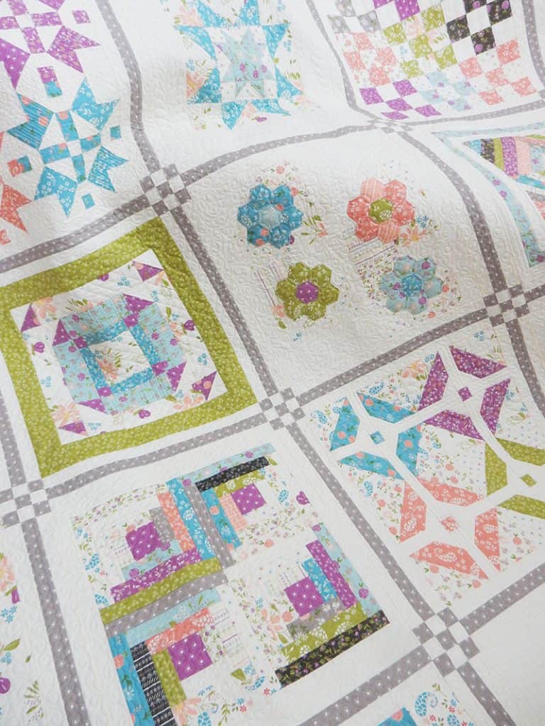 Saturday Seven 133 featured by Top US Quilting Blog A Quilting Life: image of sampler quilt
