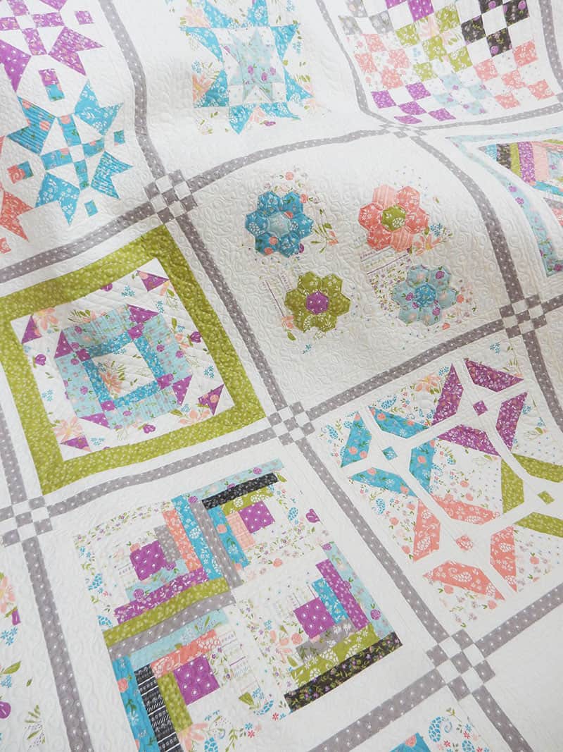 Labor of Love Quilt Along Block 1 featured by Top US Quilting Blog A Quilting Life: image of sampler quilt