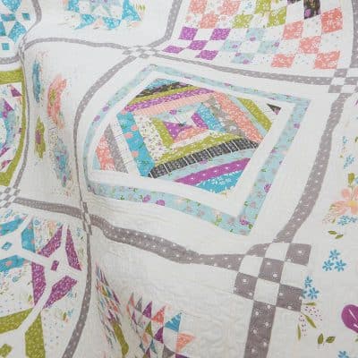 Labor of Love Sampler Quilt featured by Top US Quilting Blog, A Quilting Life: image of sampler quilt