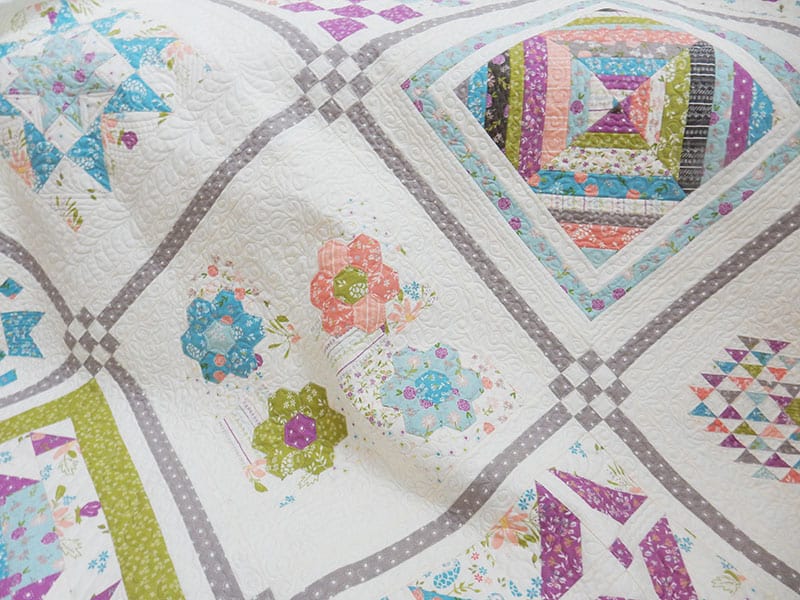 Labor of Love Sampler Quilt featured by Top US Quilting Blog, A Quilting Life: image of sampler quilt