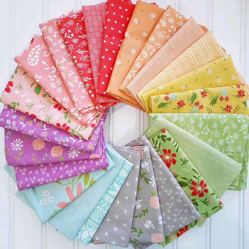 Saturday Seven 127 featured by Top US Quilting Blog, A Quilting Life: image of scrappy fabrics