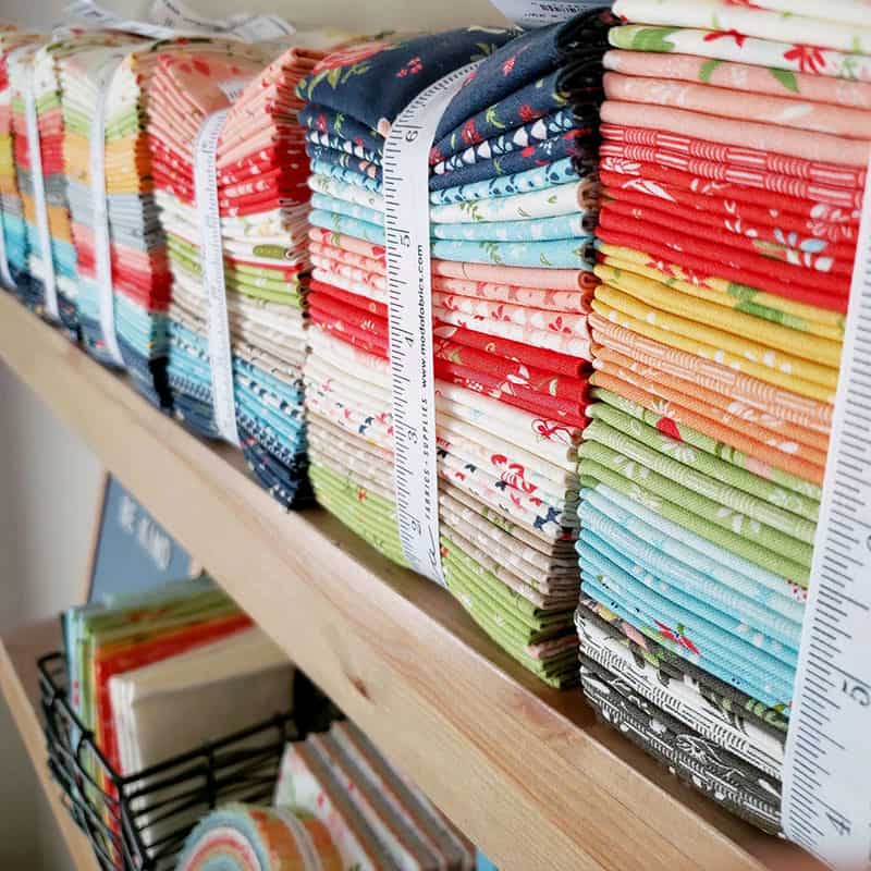 11 Productivity Tips for Quilters featured by Top US Quilting Blog, A Quilting Life: image of fabric bundles