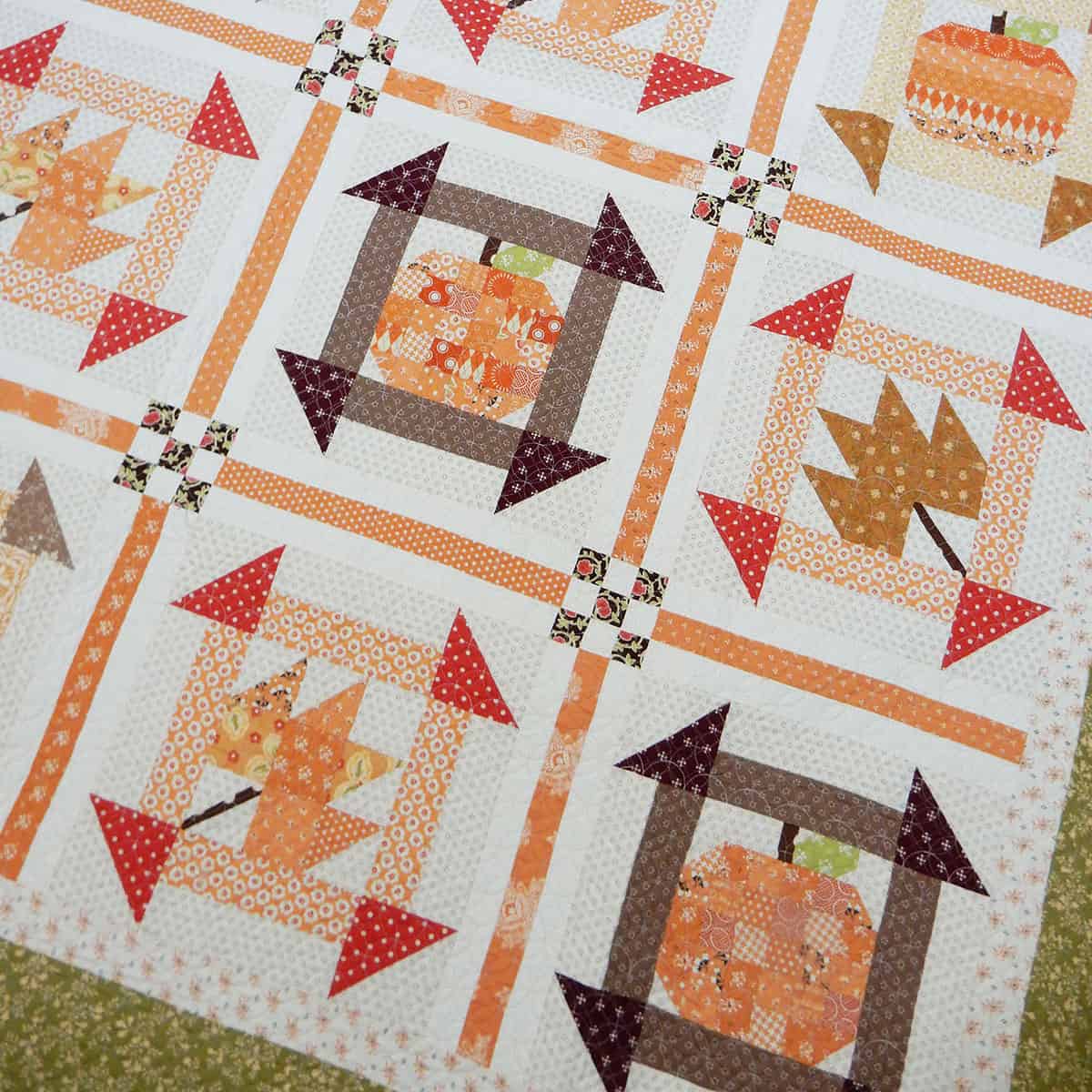 Pumpkin and leaf quilt in beautiful fall fabrics