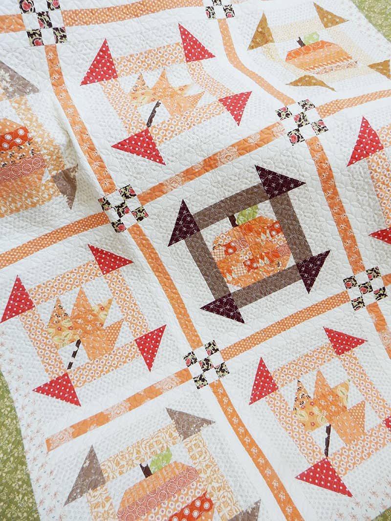 Fall Dash quilt featured by Top US Quilting Blog, A Quilting Life: image of scrappy fall quilt
