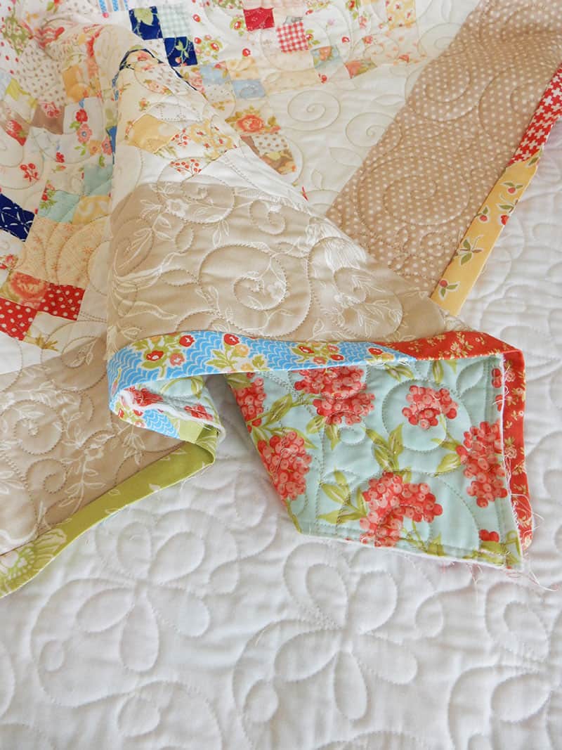 Bias Binding Tutorial featured by Top US Quilting Blog, A Quilting Life: image of Scrappy Binding