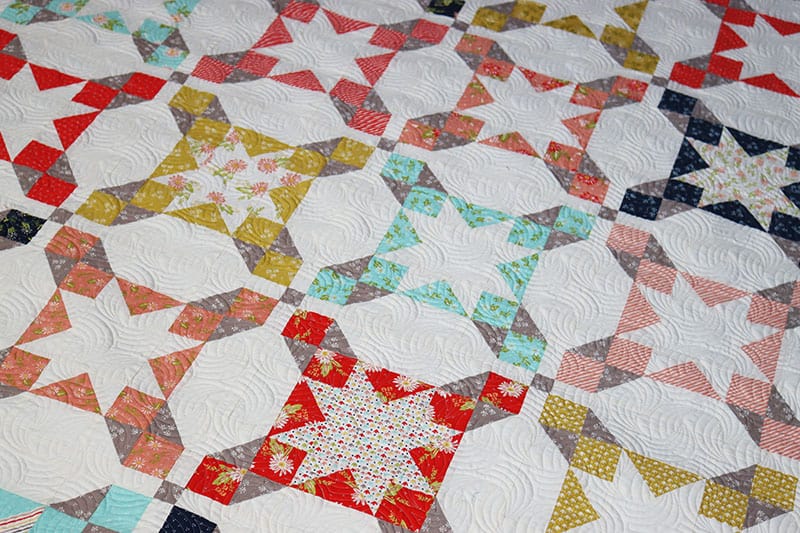 Seaside Layer Cake Quilt featured by Top US Quilting Blog, A Quilting Life: image of Seaside Layer Cake Quilt