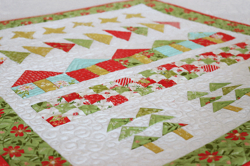 Home for Christmas Quilt Wall Hanging featured by Top US Quilting Blog, A Quilting Life. Image of Christmas quilt wall hanging