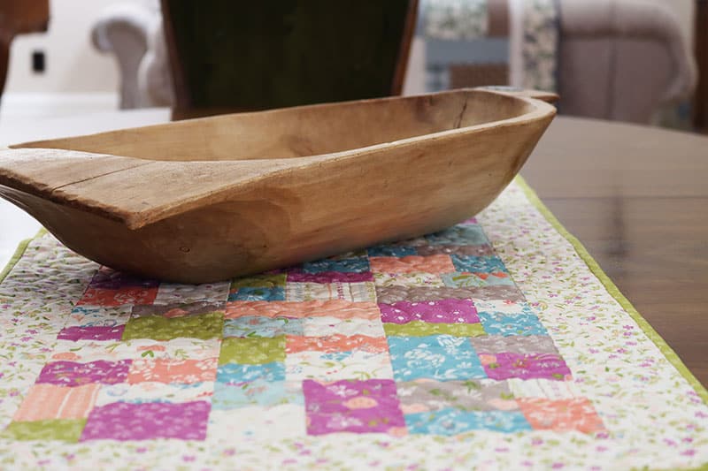 Saturday Seven 163 featured by Top US Quilting Blog, A Quilting Life: image of quilted table runner and antique dough bowl