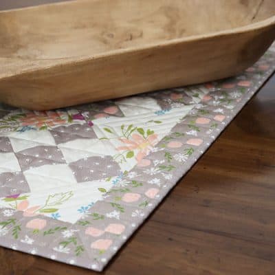 9-Patch Table Runner Tutorial featured by Top US Quilting Blog, A Quilting Life: image of scrappy 9-patch table runner