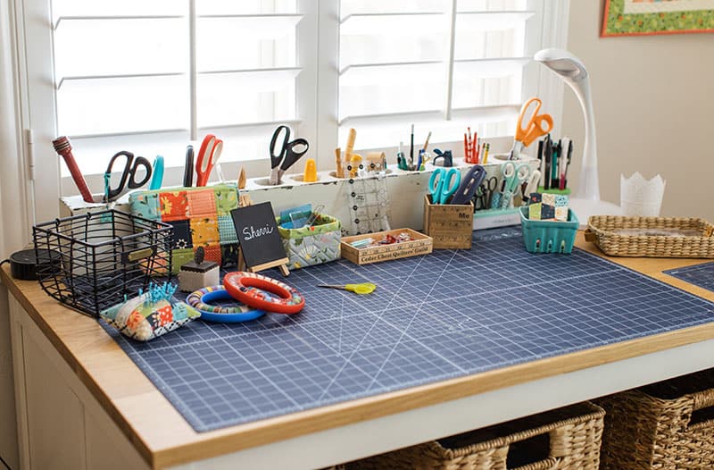 Saturday Seven 165 featured by Top US Quilting Blog, A Quilting Life: image of sewing room work table