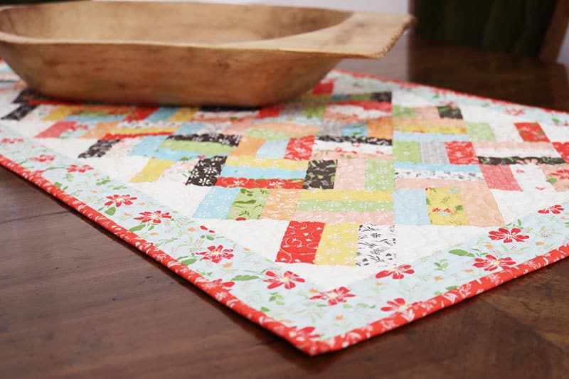 Saturday Seven 167 featured by Top US Quilting Blog, A Quilting Life: image of Happy Days Table Topper