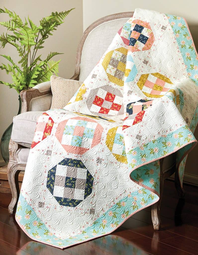 Saturday Seven 174 featured by Top US Quilting Blog, A Quilting Life: image of Plus Side Quilt by Sherri McConnell