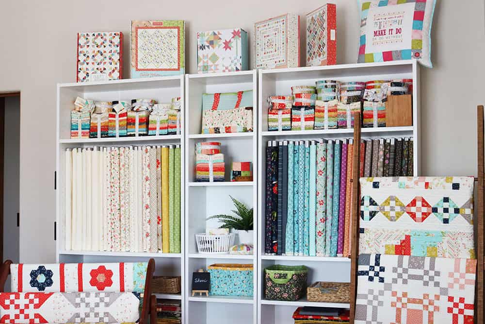 Saturday Seven 176 featured by Top US Quilting Blog: A Quilting Life. Image of sewing room fabric storage