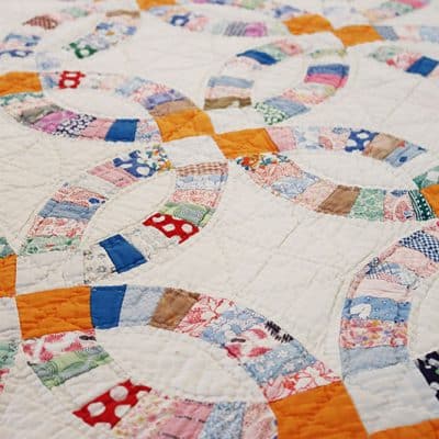 Antique Double Wedding Ring Quilt featured by Top US Quilt Blog, A Quilting Life