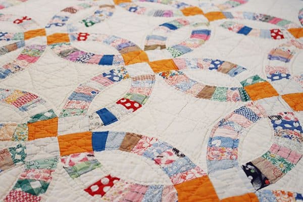 Antique Double Wedding Ring Quilt featured by Top US Quilt Blog, A Quilting Life