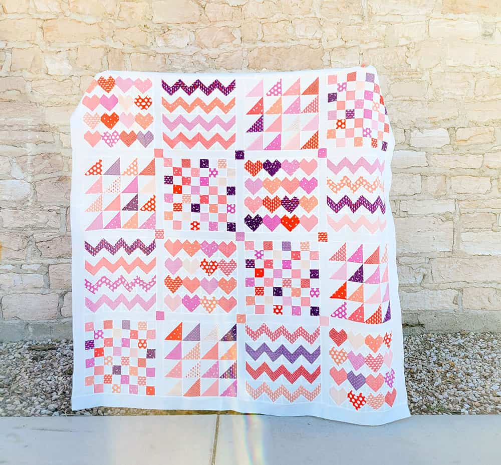 A Quilting Life Podcast Episode 50 Show Notes featured by Top US Quilt Blog, A Quilting Life Image of Be Mine Quilt by Chelsi Stratton