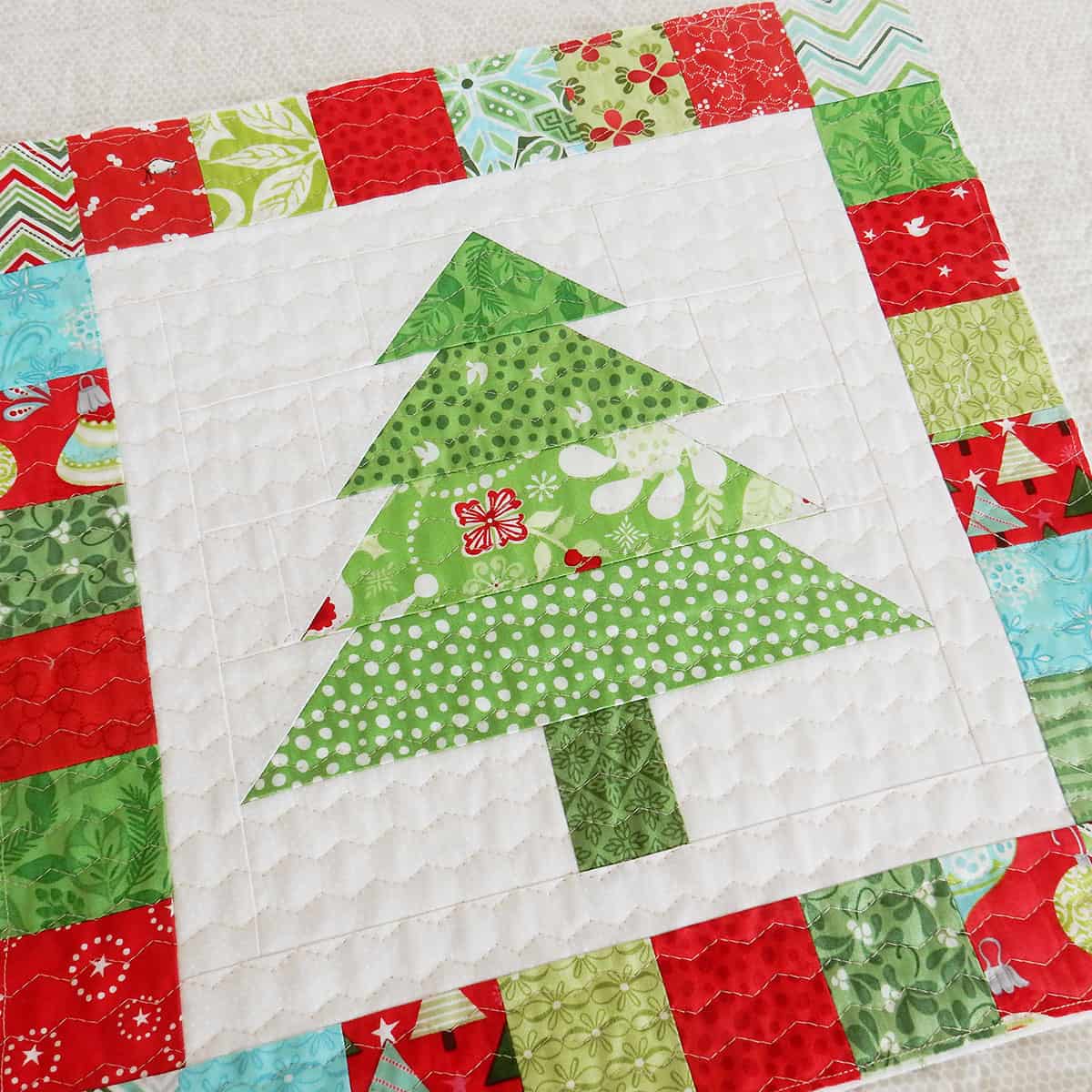 Christmas Tree Mug Rug + Pillow featured by Top US Quilt Blog, A Quilting Life