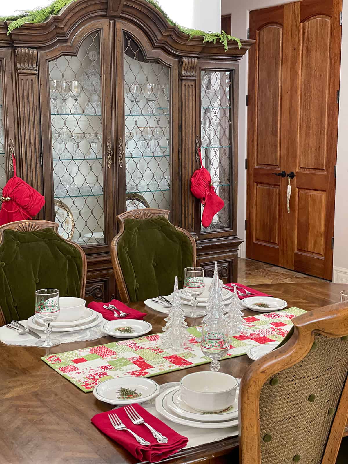 Christmas dinner table with centerpiece and tree plates