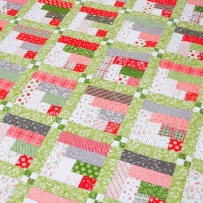 Season's Greetings Jelly Roll Quilt featured by Top US Quilt Blog, A Quilting Life