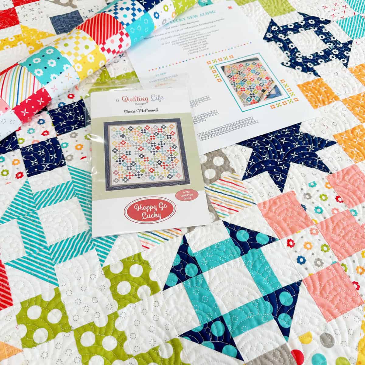 Scrappy Patchwork Happy Go Lucky Quilt from Sherri at A Quilting Life