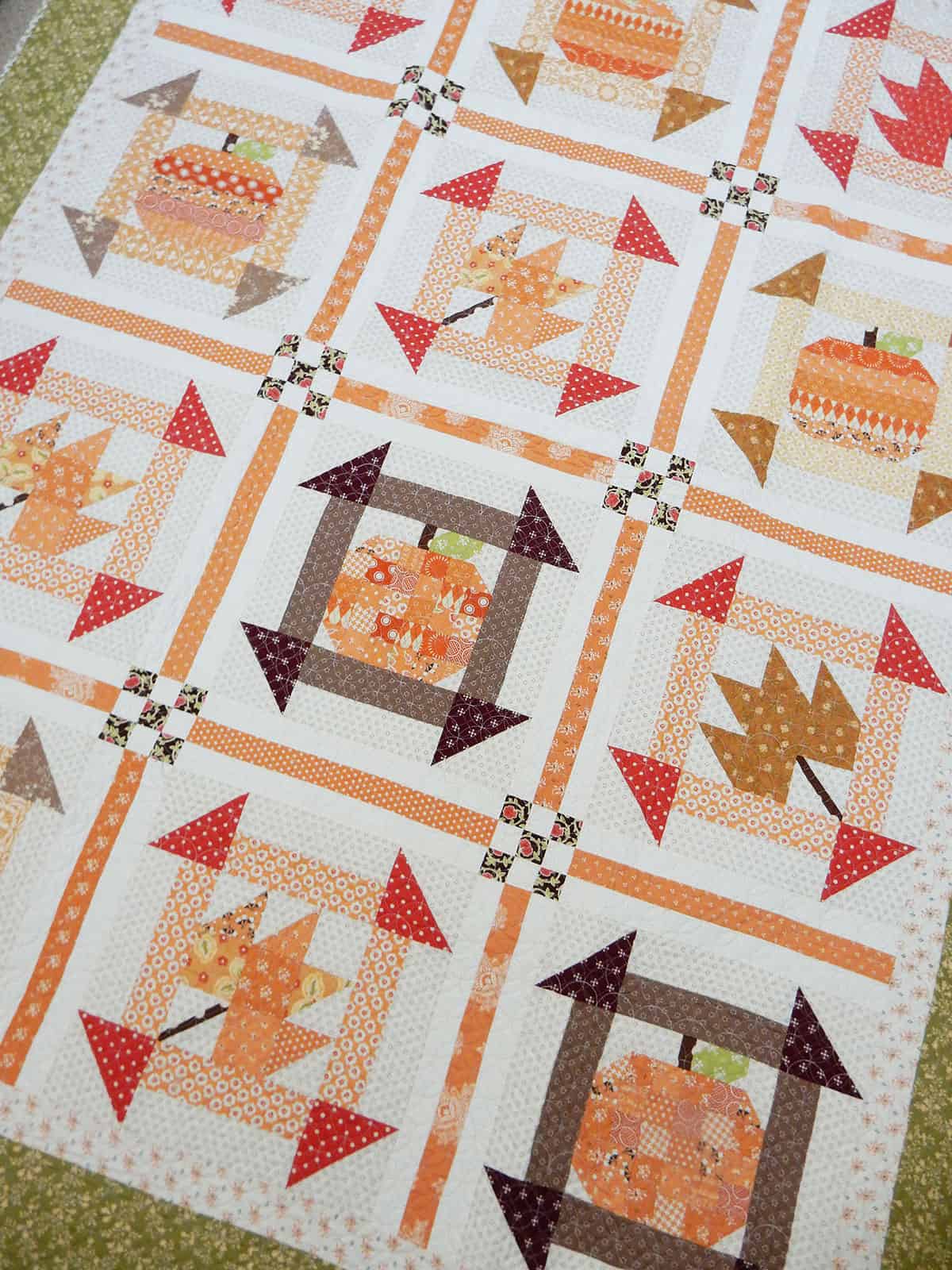 Pumpkin and leaf quilt in beautiful fall fabrics