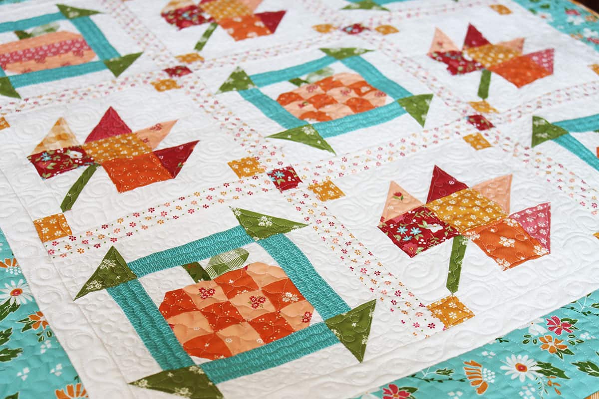 Pumpkin and leaf quilt in beautiful fall fabrics