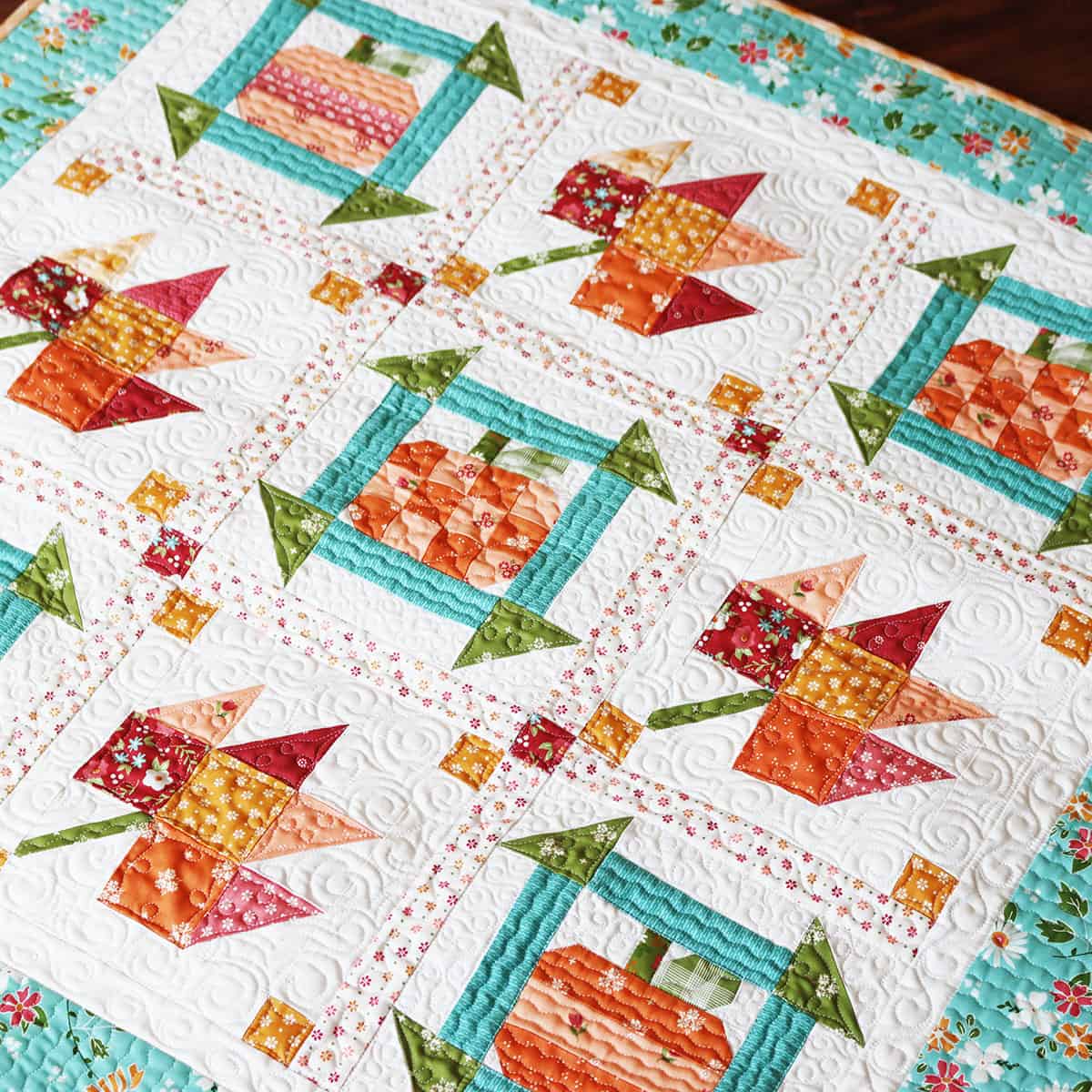 Pumpkin and leaf quilt in beautiful fall fabrics