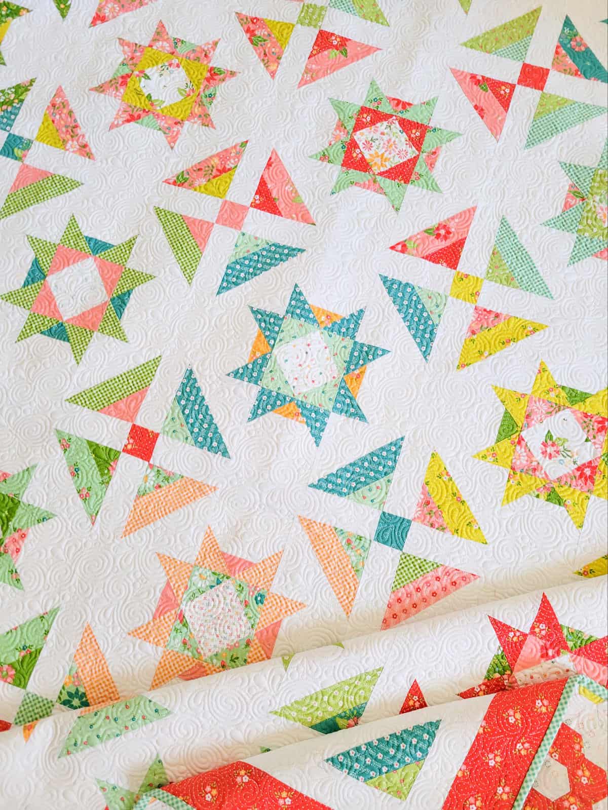 Stars and Patchwork quilt in a rainbow of bright colors