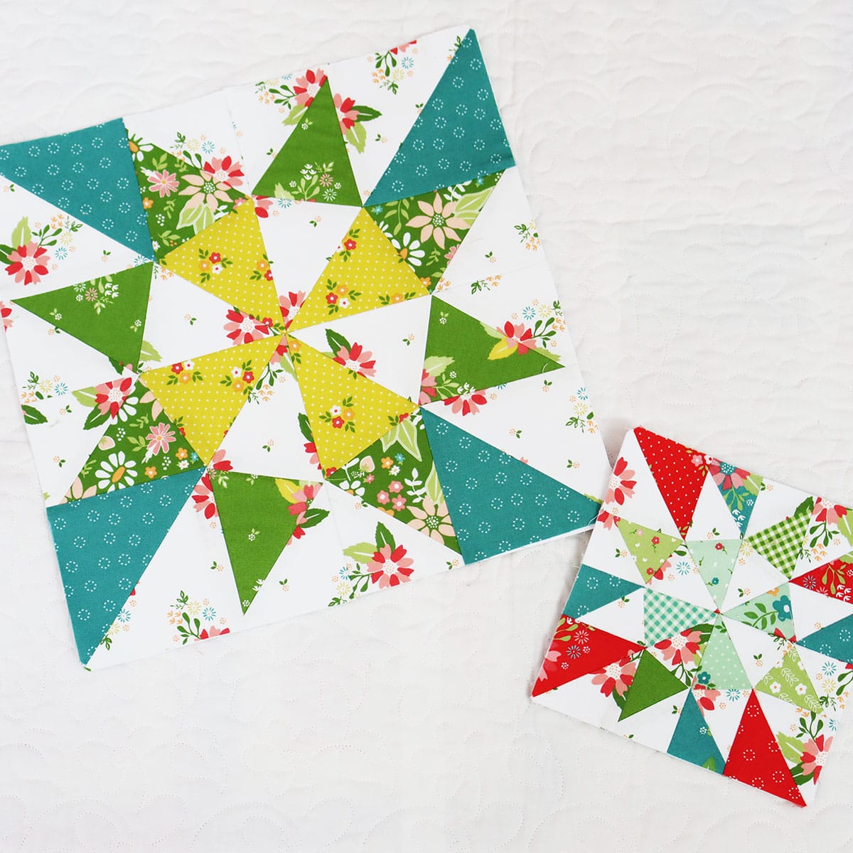 scrappy quilt blocks in bright colors of teal, aqua, green, citrine, and red.