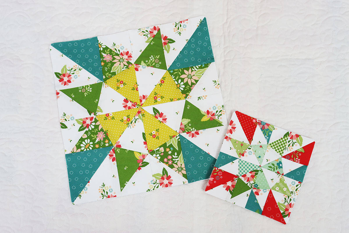 Scrappy quilt blocks in bright fabrics with teal, green, citrine, red, and aqua.